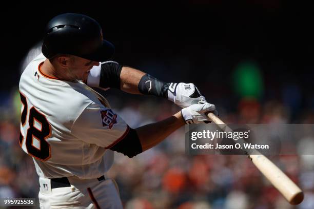 Buster Posey of the San Francisco Giants at bat against the St. Louis Cardinals during the seventh inning at AT&T Park on July 8, 2018 in San...