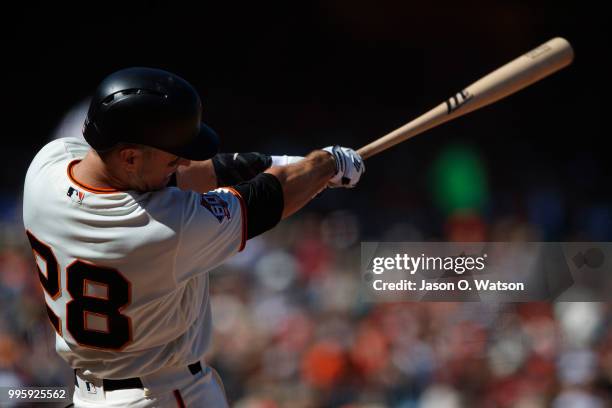 Buster Posey of the San Francisco Giants at bat against the St. Louis Cardinals during the seventh inning at AT&T Park on July 8, 2018 in San...