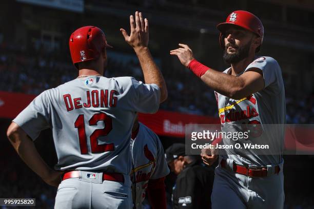 Matt Carpenter of the St. Louis Cardinals is congratulated by Paul DeJong after hitting a three run home run against the San Francisco Giants during...