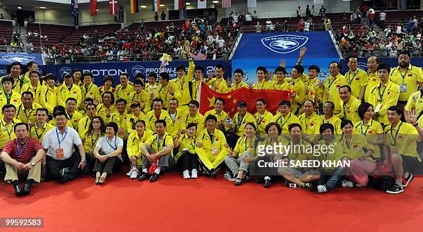 Gold medalists of China pose with the trophy after defeating Indonesia in the finals round of the Thomas Cup badminton championships in Kuala Lumpur...