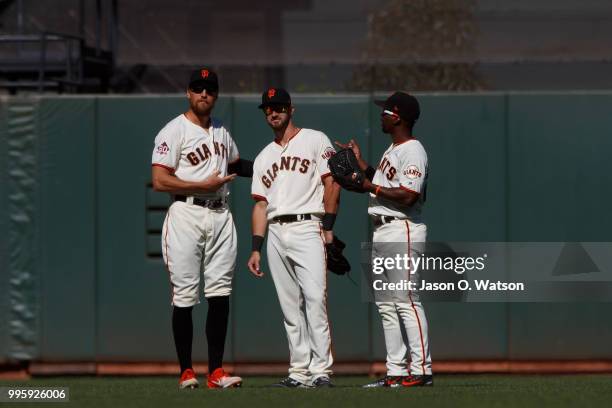 Hunter Pence of the San Francisco Giants, Steven Duggar and Andrew McCutchen celebrate after the game against the St. Louis Cardinals at AT&T Park on...