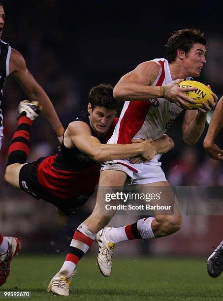 Lenny Hayes of the Saints is tackled by Ben Howlett of the Bombers during the round eight AFL match between the St Kilda Saints and the Essendon...