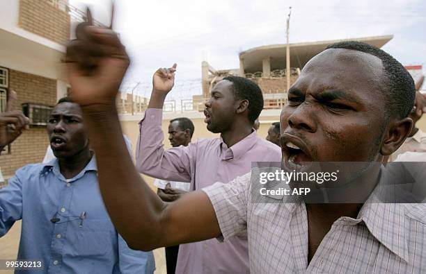 Sudanese supporters of opposition leader Hassan al-Turabi protest against his detention outside the headquarters of his Popular Congress Party in...