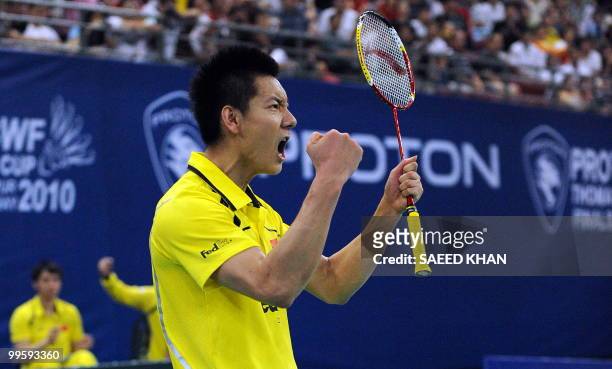 China's Chen Jin shouts after defeating Indonesia's Simon Santoso in the finals round of the Thomas Cup badminton championships in Kuala Lumpur on...