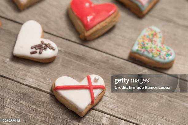 several delicious cookies with icing - coração de animal imagens e fotografias de stock