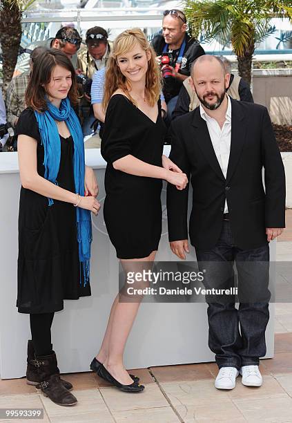 Actresses Pauline Etienne, Louise Bourgoin and Director Gilles Marchand attend the 'Black Heaven' Photo Call held at the Palais des Festivals during...