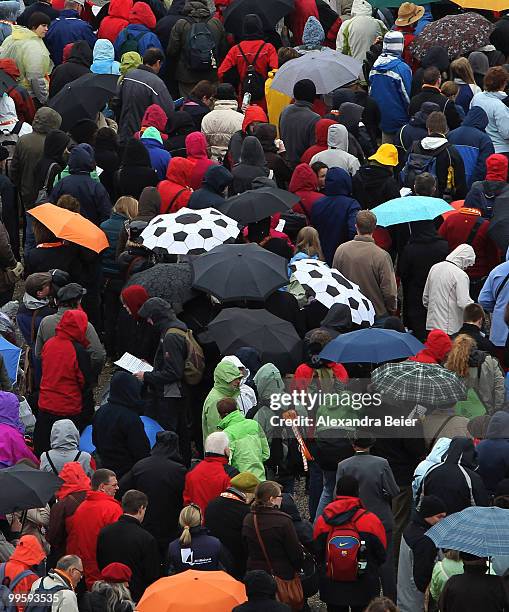 Two umbrellas looking like soccer balls are seen during the final holy mass at the last day of the 2nd Ecumenical Church Day on May 16, 2010 in...