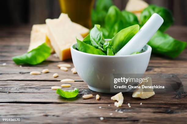 italian traditional pesto on the wooden table - pesto stock pictures, royalty-free photos & images