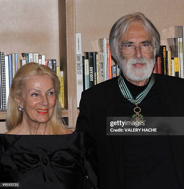 Austrian writer-director Michael Haneke poses with his wife Suzie after receiving the Commandeur de l'Ordre des Arts et des Lettres from French...