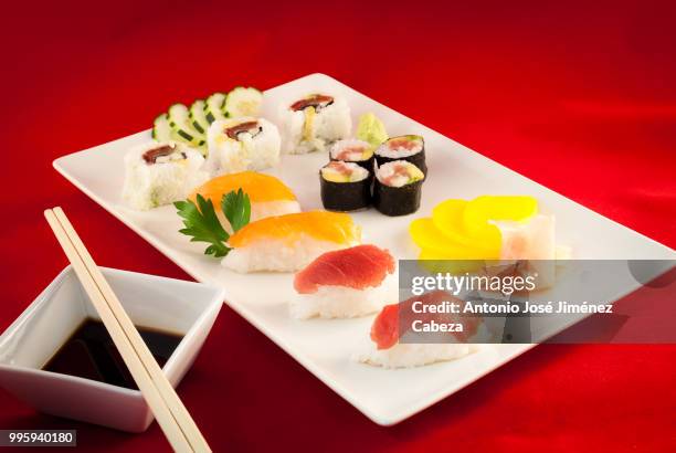 sushi bluefin tuna fish varied with chopsticks - cabeza stock pictures, royalty-free photos & images