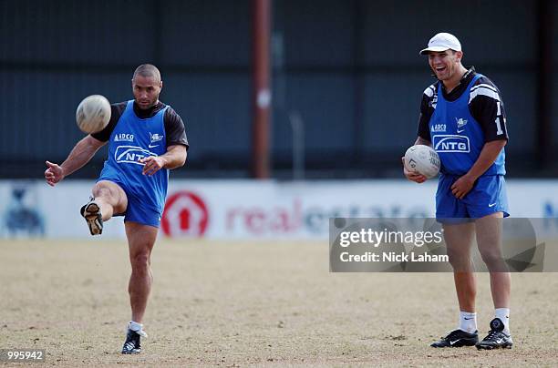 Steven Price watches on as team mate Craig Polla-Mounter practices his kicking during the Bulldogs morning training session held at Belmore Sports...