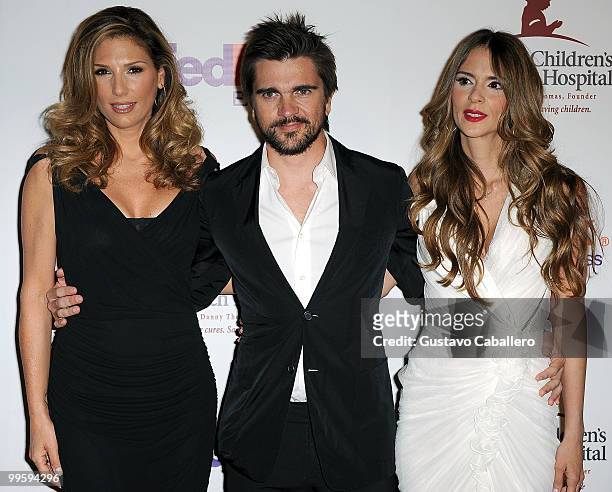 Daisy Fuentes, Juanes and Karen Martinez arrive at the 8th Annual FedEx and St. Jude Angels and Stars Gala at InterContinental Hotel on May 15, 2010...