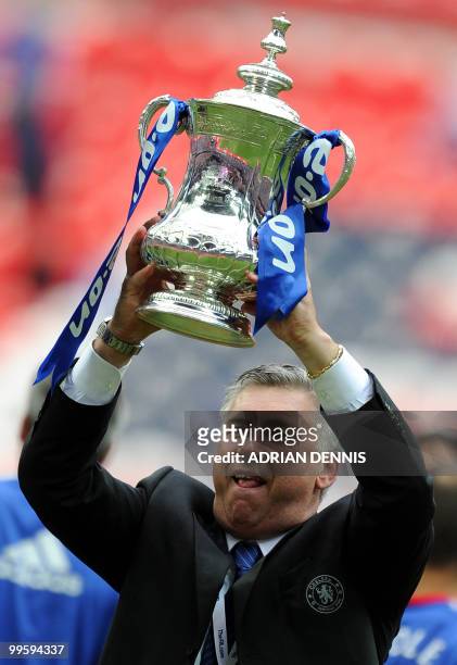 Chelsea manager Carlo Ancelotti lifts the FA Cup after his team beat Portsmouth 1-0 during the FA Cup Final football match at Wembley, in north...