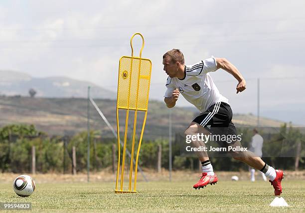 Lukas Podolski of Germany is seen in action during the German National Team training session at Verdura Golf and Spa Resort on May 16, 2010 in...