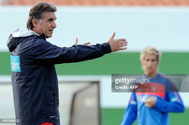 Portugal's coach Carlos Queiroz gestures as defender Fabio Coentrao looks on during the team's second training session at Santos Pinto Stadium in...