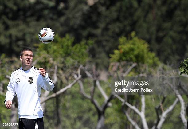 Lukas Podolski of Germany is seen in action during the German National Team training session at Verdura Golf and Spa Resort on May 16, 2010 in...