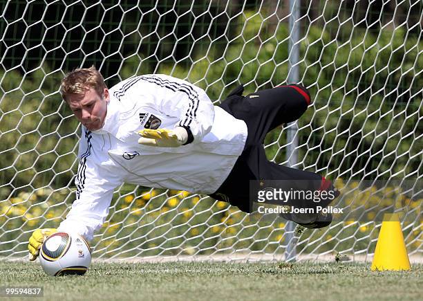 Manuel Neuer of Germany saves a ball during the German National Team training session at Verdura Golf and Spa Resort on May 16, 2010 in Sciacca,...