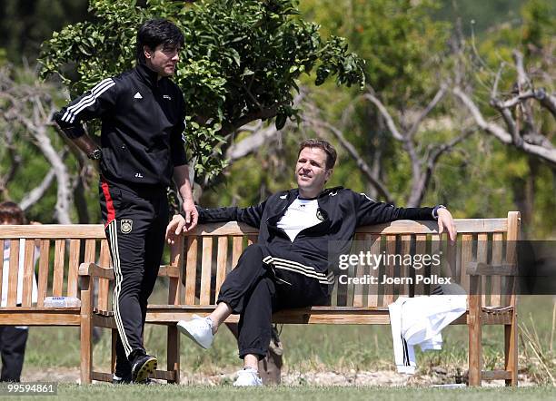 Head coach Joachim Loew talks to team manager Oliver Bierhoff of Germany during the German National Team training session at Verdura Golf and Spa...