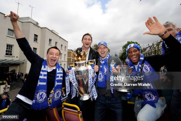John Terry , Frank Lampard, Petr Cech and Didier Drogba of Chelsea pose with the Premier League and FA Cup trophies during the Chelsea Football Club...