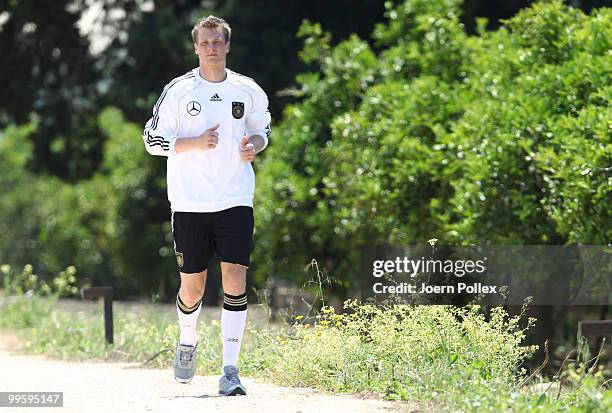 Marcell Jansen of Germany is seen jogging during the German National Team training session at Verdura Golf and Spa Resort on May 16, 2010 in Sciacca,...