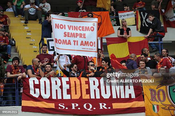 Roma supporters hold a banner reading "We will win always, Rome I love you" prior their team's Italian serie A football match Chievo vs AS Roma, at...