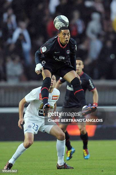 Paris Saint-Germain's French forward Guillaume Hoarau vies with Montpellier's Jamel Saihi during their French L1 football match Paris Saint-Germain...