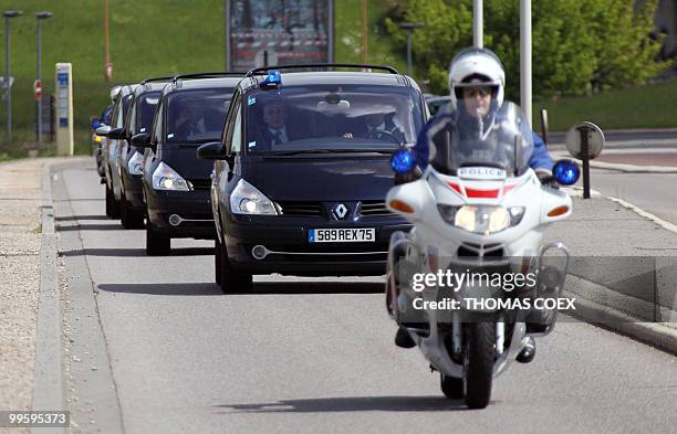 French governmental convoy drives from Velizy-Villacoublay military airport, outside Paris, on May 16, 2010 with French academic Clotilde Reiss on...