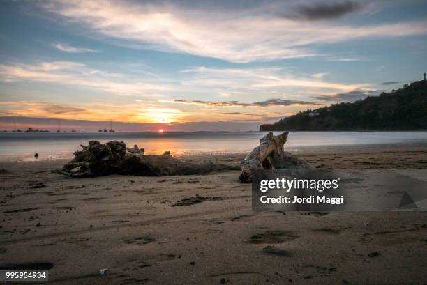 enjoying a sunset in san juan del sur, nicaragua. - san juan del sur stockfoto's en -beelden