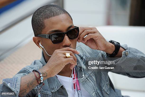 Pharrell Williams talks on his mobile phone at the Red Bull Formula 1 Energy Station on May 16, 2010 in Monaco, France.