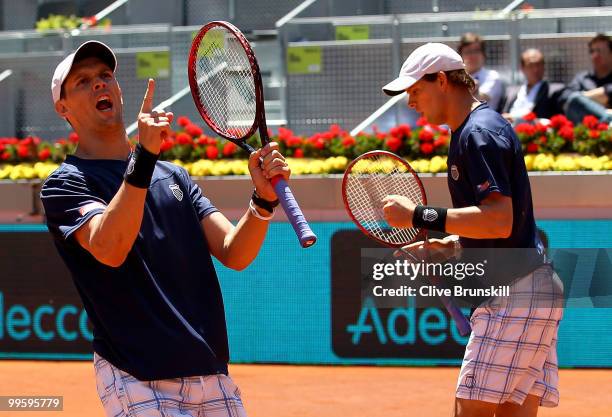 Mike Bryan and Bob Bryan of the USA celebrate a point against Daniel Nestor of Canada and Nenad Zimonjic of Serbia in the mens doubles final match...