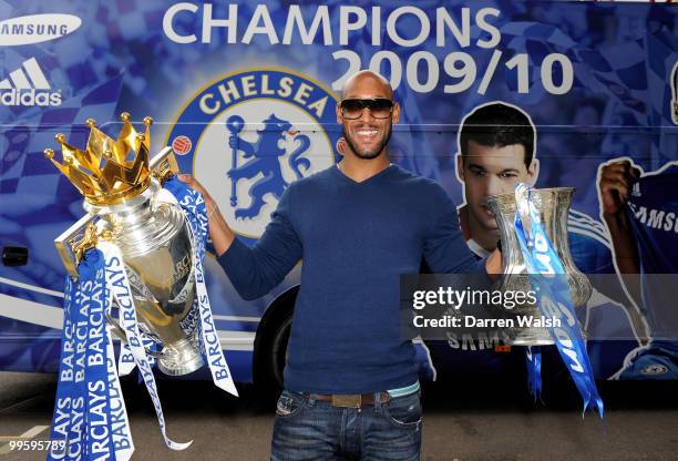 Nicolas Anelka of Chelsea poses with the Premier League and FA Cup trophies prior to the Chelsea Football Club Victory Parade on May 16, 2010 in...