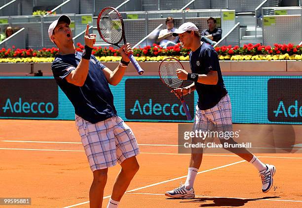 Mike Bryan and Bob Bryan of the USA celebrate a point against Daniel Nestor of Canada and Nenad Zimonjic of Serbia in the mens doubles final match...