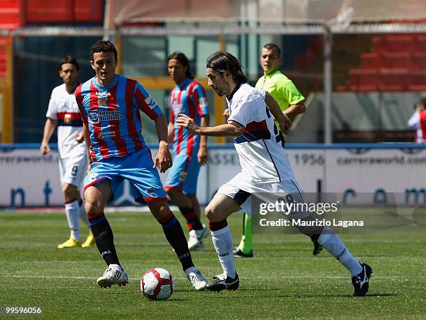Pablo Ledesma of Catania Calcio battles for the ball with Ivan Juric of Genoa CFC during the Serie A match between Catania Calcio and Genoa CFC at...