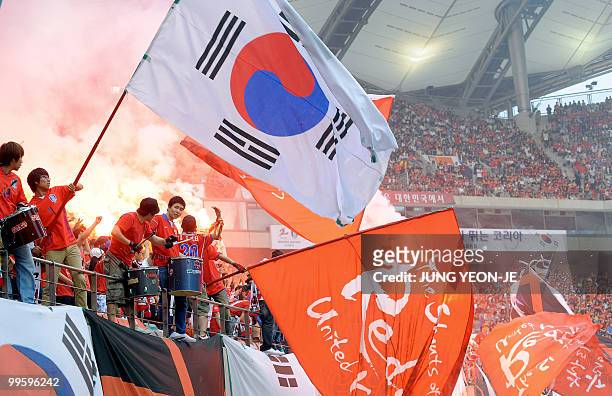 South Korean national football team "Red Devil" supporters cheer during a friendly football match with Ecuador in Seoul on May 16 ahead the...
