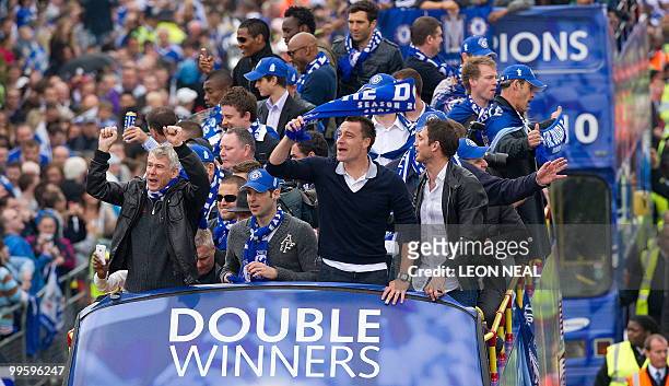 Members of the Chelsea football squad parade through the streets of west London on May 16, 2010 as they celebrate winning the the Barclays...
