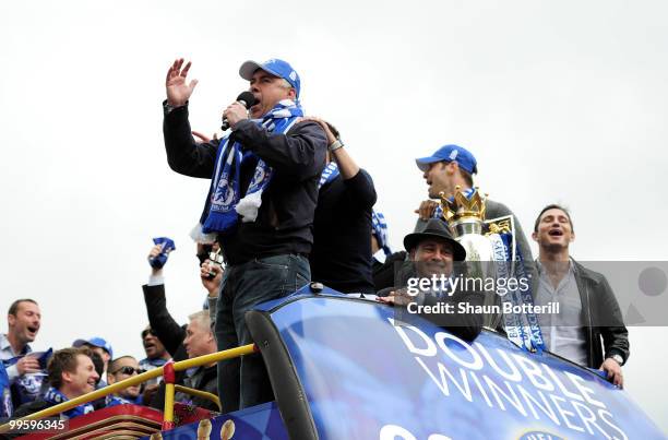 Carlo Ancelotti the Chelsea coach sings to the crowd during the Chelsea FC Victory Parade on May 16, 2010 in London, England.