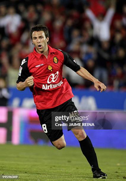 Mallorca's forward Victor Manuel Casadesus celebrates after scoring against Espanyol during their Spanish League football match at the Ono Stadium in...