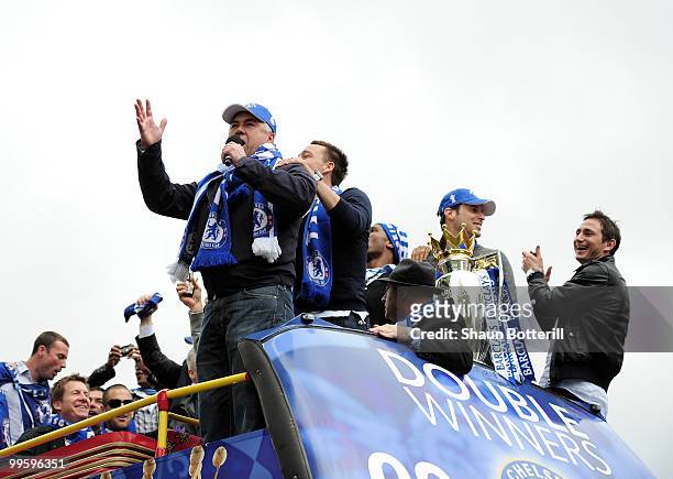 Carlo Ancelotti the Chelsea coach sings to the crowd during the Chelsea FC Victory Parade on May 16, 2010 in London, England.