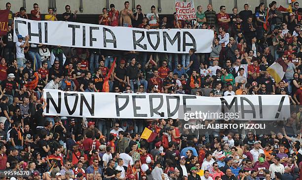 Roma's supporters hold a banner reading " Who supports AS Roma never lose" during their team's Italian serie A football match against Chievo at...