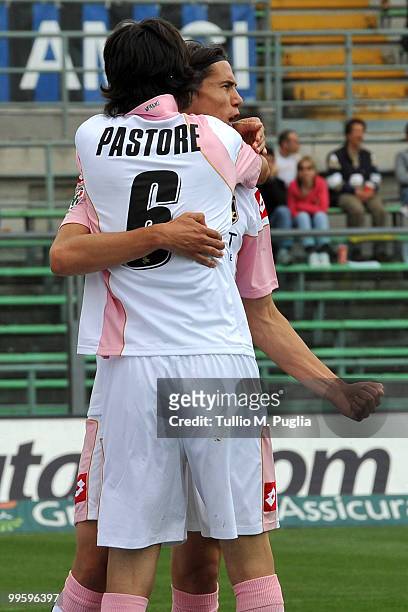 Edinson Cavani of Palermo celebrates the opening goal with his team mate Javier Pastore during the Serie A match between Atalanta BC and US Citta di...
