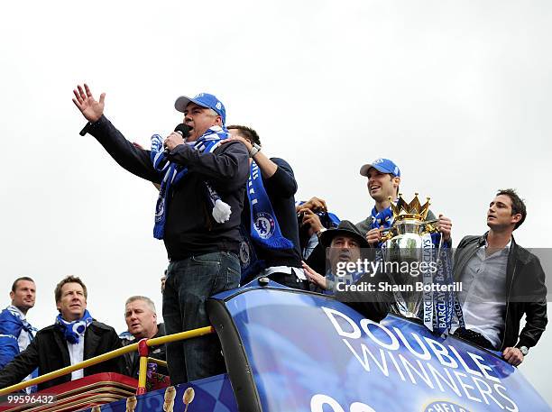 Carlo Ancelotti the Chelsea coach sings to the crowd during the Chelsea FC Victory Parade on May 16, 2010 in London, England.