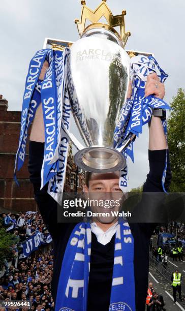 John Terry of Chelsea poses with the Premier League trophy during the Chelsea Football Club Victory Parade on May 16, 2010 in London, England.