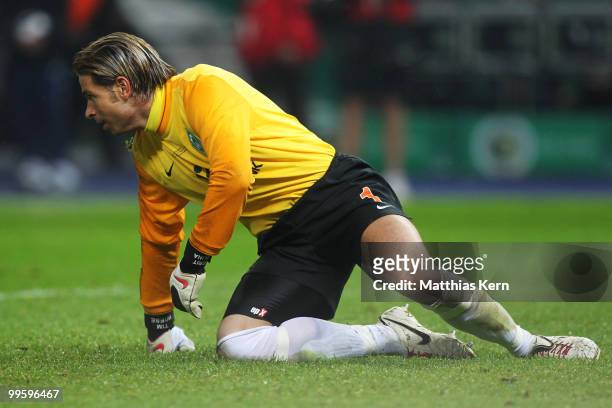 Goalkeeper Tim Wiese of Bremen knies on the pitch during the DFB Cup final match between SV Werder Bremen and FC Bayern Muenchen at Olympic Stadium...