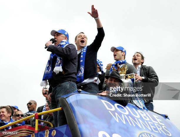Carlo Ancelotti the Chelsea coach and captain John Terry sing to the crowd during the Chelsea FC Victory Parade on May 16, 2010 in London, England.