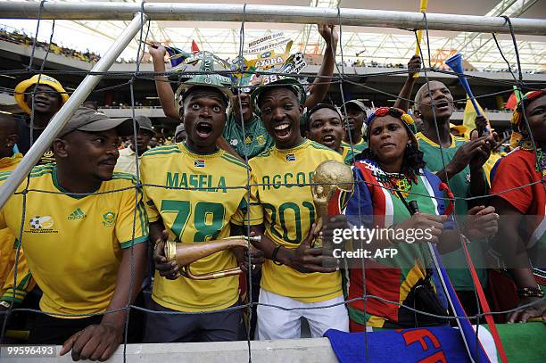Supporters of the South African national football team cheer on May 16, 2010 at the Mbombela Stadium in Nelspruit during the international friendly...
