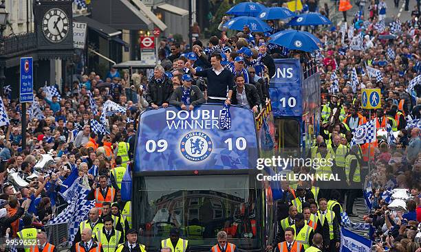 Members of the Chelsea football squad parade through the streets of west London on May 16, 2010 as they celebrate winning the Barclays Premiership...