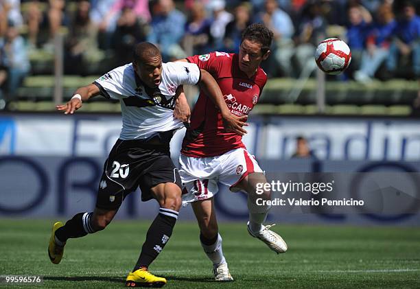 Jonathan Ludovic Biabiany of Parma FC battles for the ball with Samuele Modica of AS Livorno Calcio during the Serie A match between Parma FC and AS...