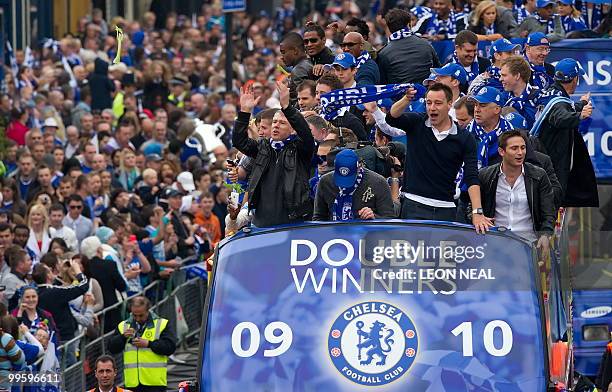 Members of the Chelsea football squad parade through the streets of west London on May 16, 2010 as they celebrate winning the the Barclays...