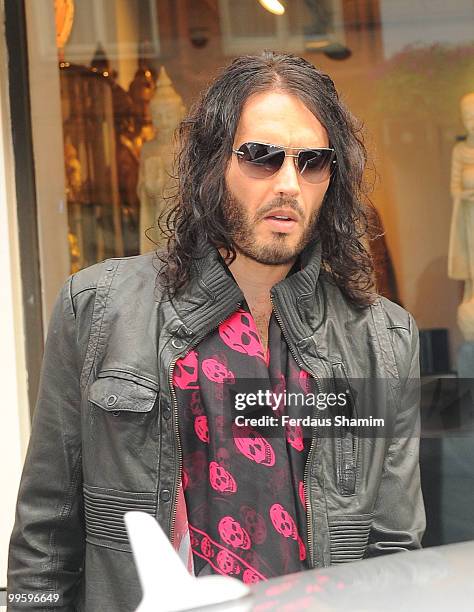Russell Brand leaves the Claridge's Hotel before the wedding of David Walliams and Lara Stone at Claridge's Hotel on May 16, 2010 in London, England.