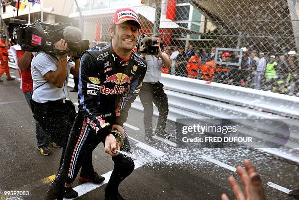 Red Bull's Australian driver Mark Webber celebrates at the Monaco street circuit on May 16 after the Monaco Formula One Grand Prix. Red Bull's...